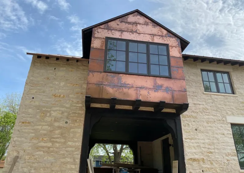 Copper metal panel facade on a stone building for Metal Roof Coating in Connersville